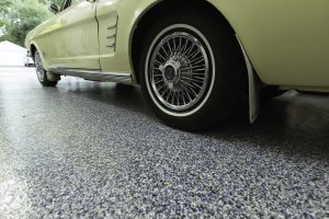 newly coated garage floor with yellow car