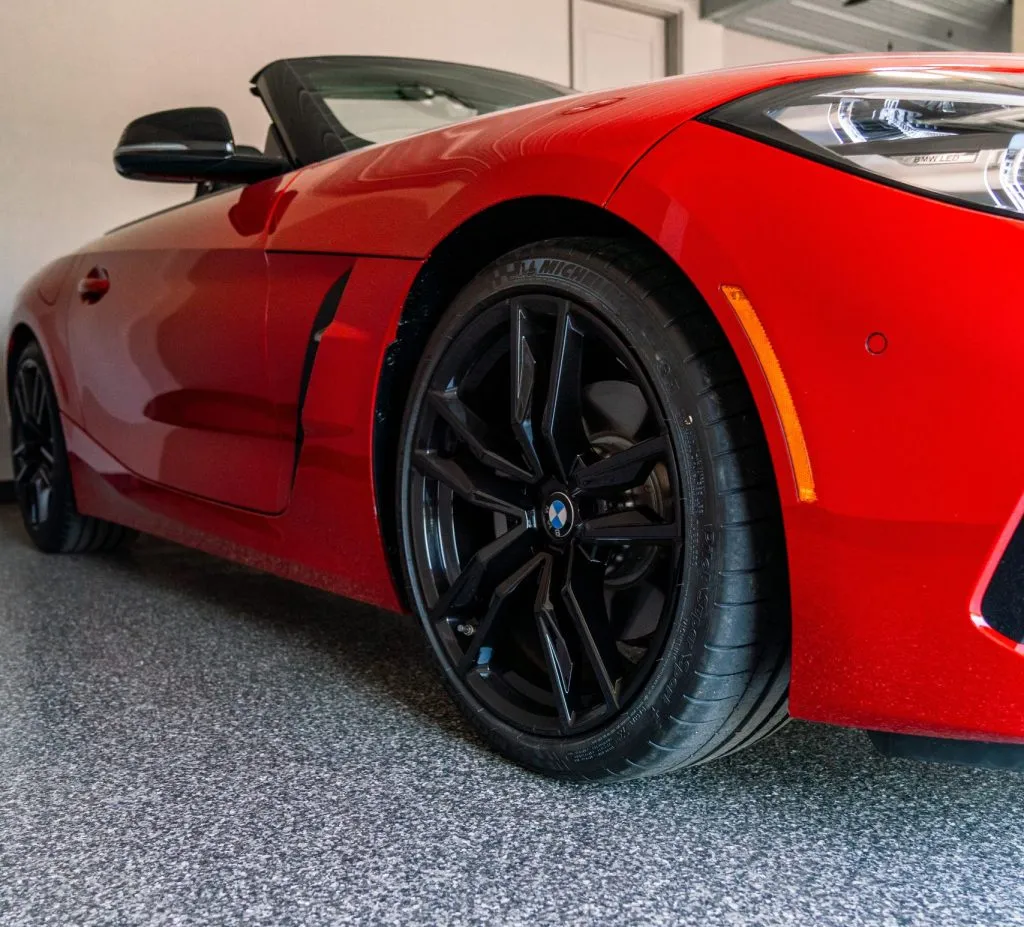 This image features a red BMW Z4, which is a luxury sports car.