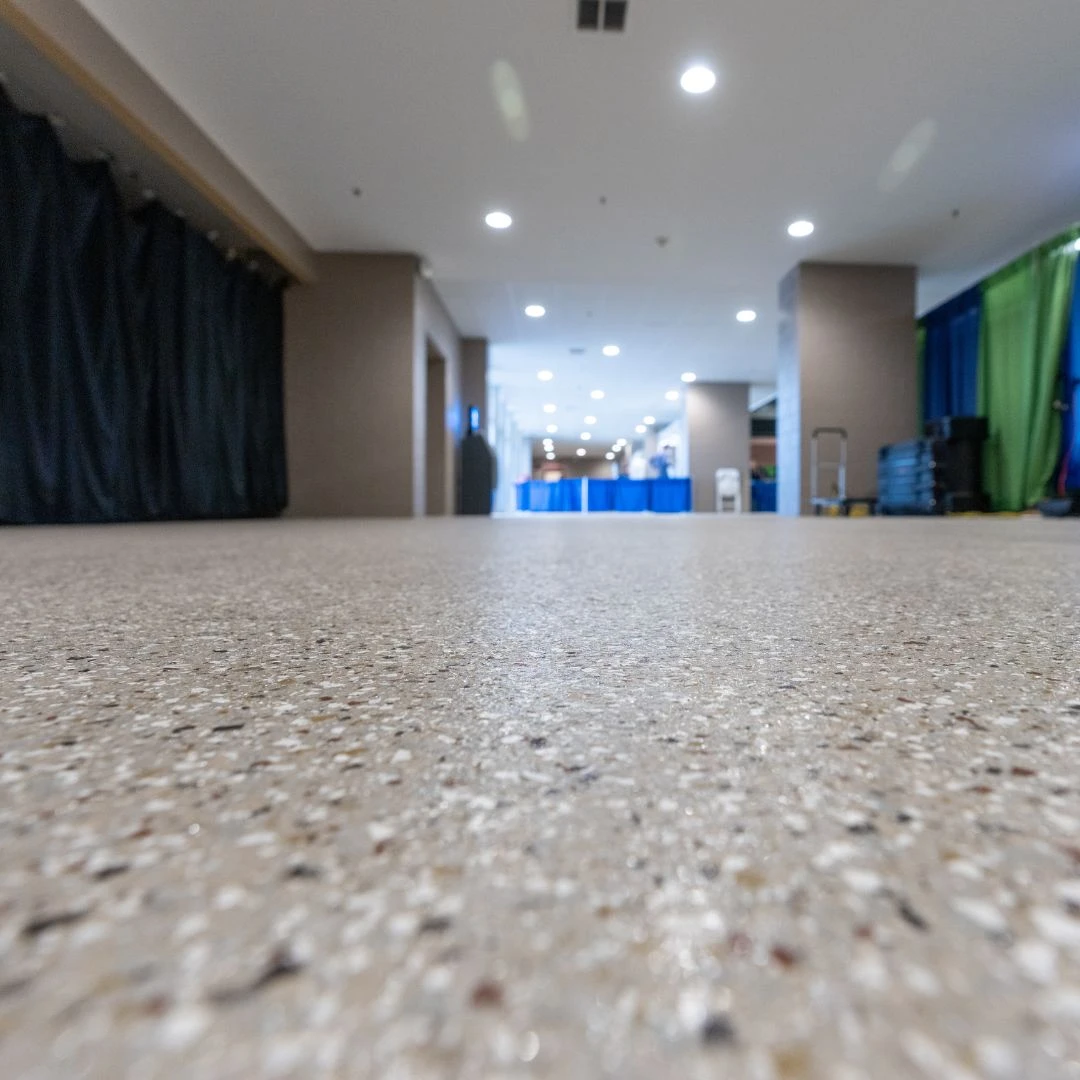 a modern polished concrete or epoxy terrazzo flooring system.
