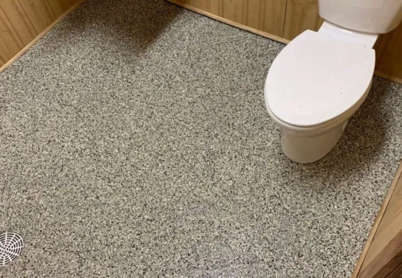 is a decorative flake epoxy bathroom floor coating.