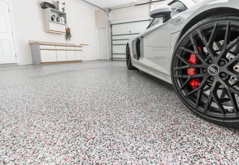 a decorative epoxy floor coating with vinyl chip flakes, commonly installed in garages for durability and aesthetic appeal.