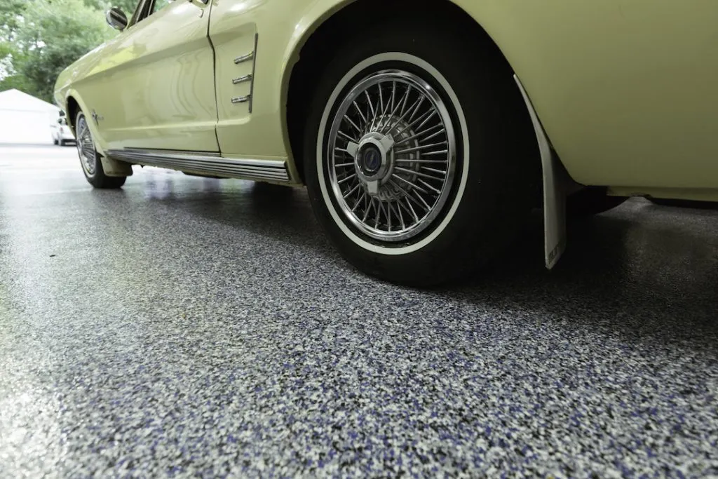 newly coated garage floor with yellow car