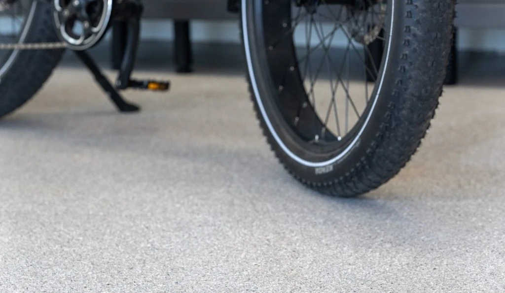 bicycle parked on concrete coating in garage